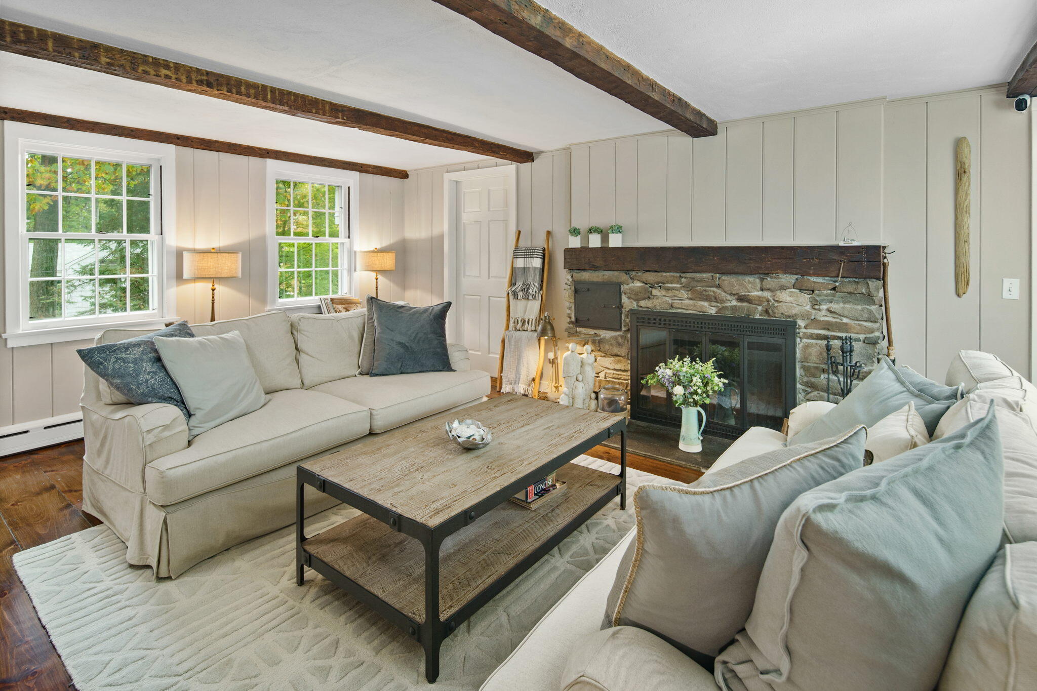 7 Little Brook Road Rowayton, CT 06853 - Photo 6 of 36 a living room with furniture and a fireplace