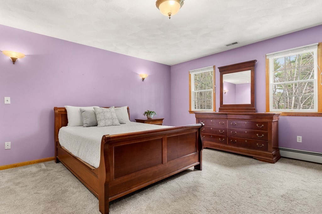 628 Boston Road Groton, MA 01450 - Photo 19 of 32 a bed room with a bed and a window