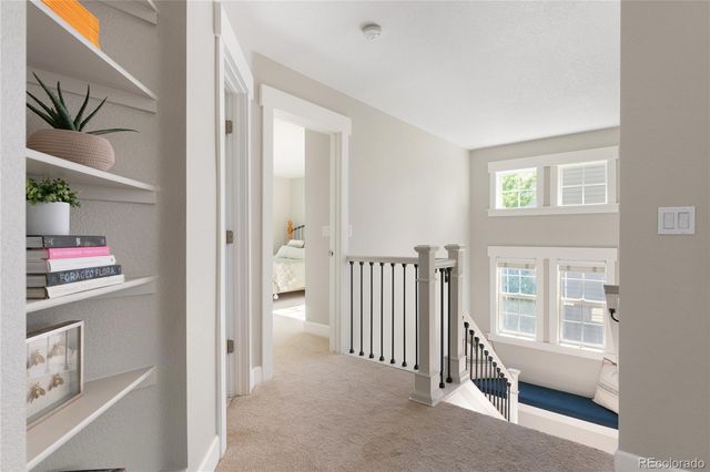 a view of hallway with bathroom and entryway