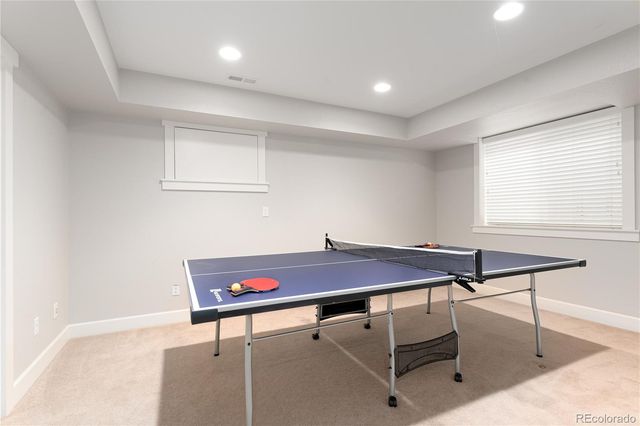 a patio with table and window