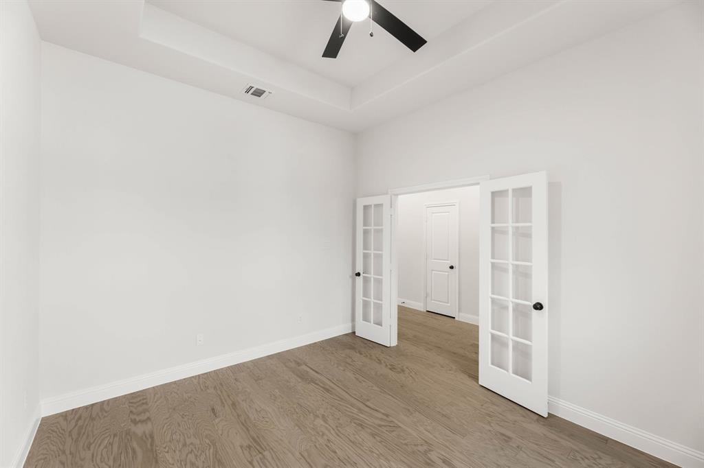 733 Wine Cup Way Midlothian, TX 76065 - Photo 11 of 30 an empty room with a ceiling fan and window