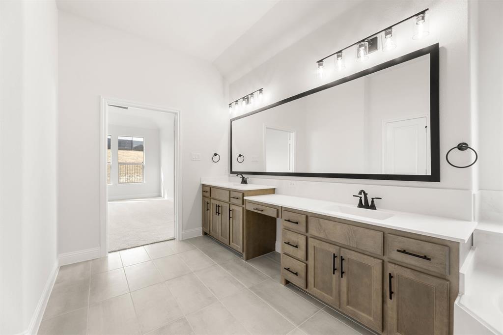 733 Wine Cup Way Midlothian, TX 76065 - Photo 14 of 30 a bathroom with a double vanity sink mirror and