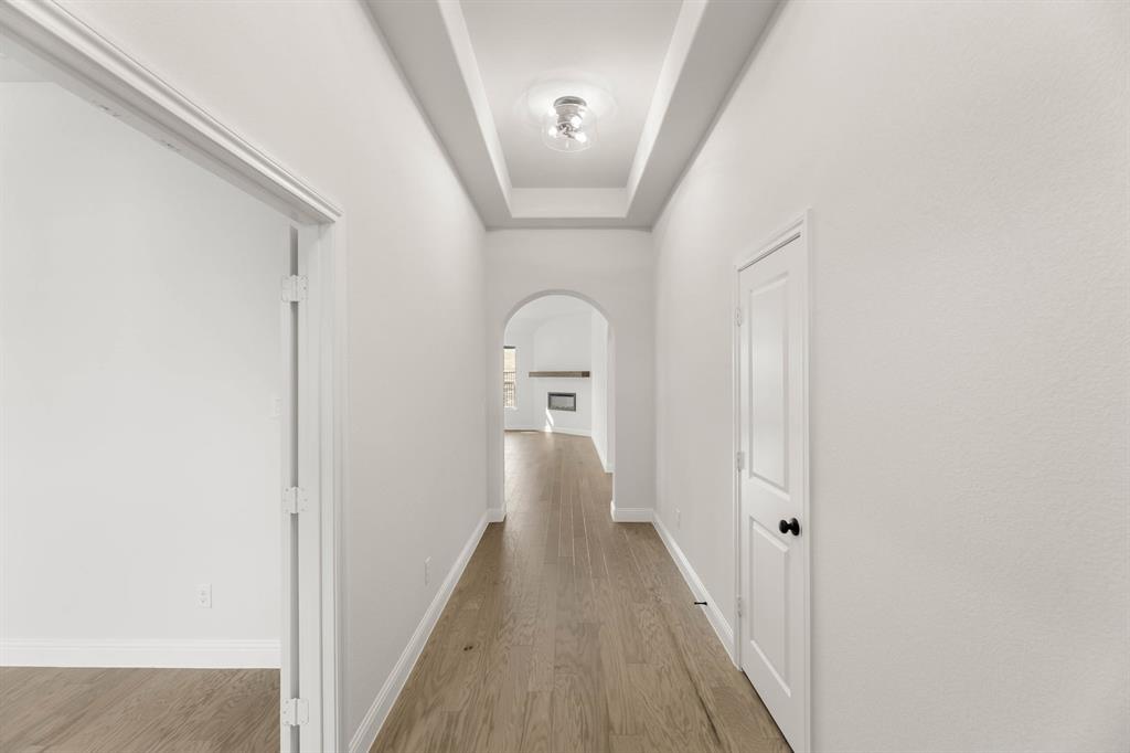 733 Wine Cup Way Midlothian, TX 76065 - Photo 22 of 30 a view of a hallway with wooden floor and entryway