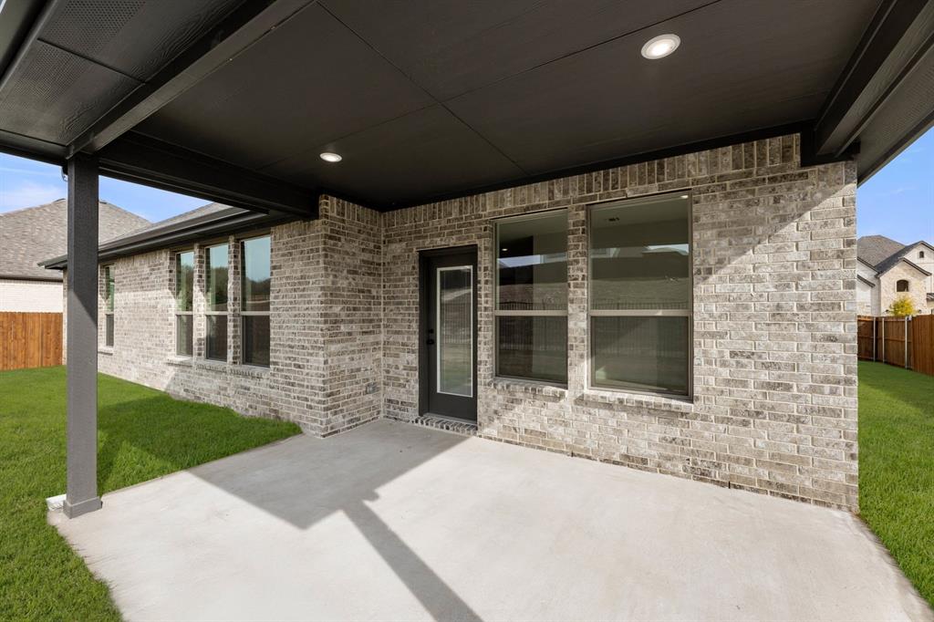 733 Wine Cup Way Midlothian, TX 76065 - Photo 24 of 30 a front view of a house with a yard
