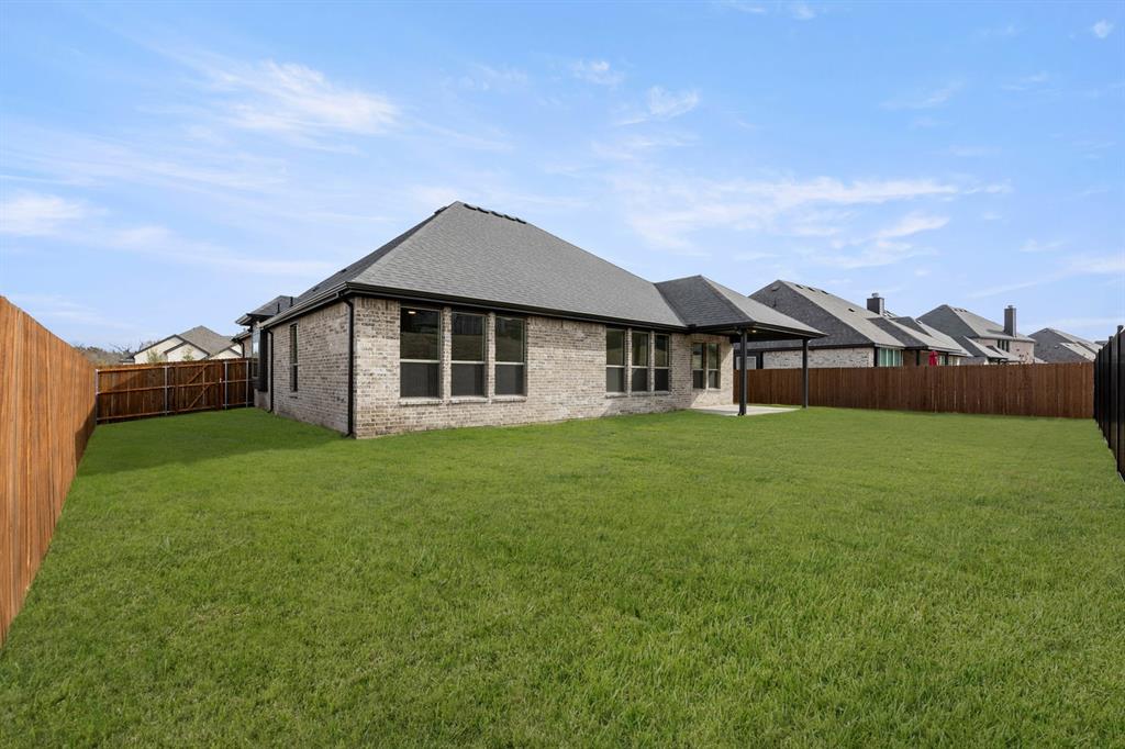 733 Wine Cup Way Midlothian, TX 76065 - Photo 26 of 30 a front view of a house with a garden