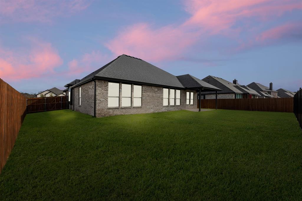 733 Wine Cup Way Midlothian, TX 76065 - Photo 27 of 30 a front view of a house with a garden