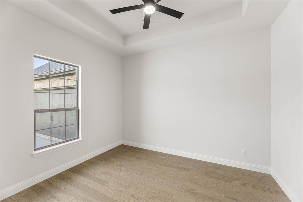 733 Wine Cup Way Midlothian, TX 76065 - Photo 10 of 30 an empty room with windows and fan