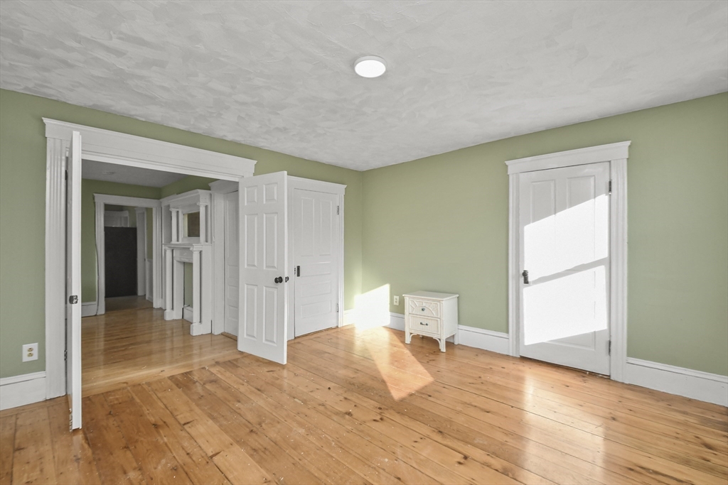 23 Ashton Street Worcester, MA 01605 - Photo 18 of 41 a view of a room with wooden floor and furniture