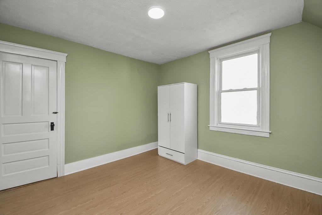 23 Ashton Street Worcester, MA 01605 - Photo 23 of 41 an empty room with windows and closet