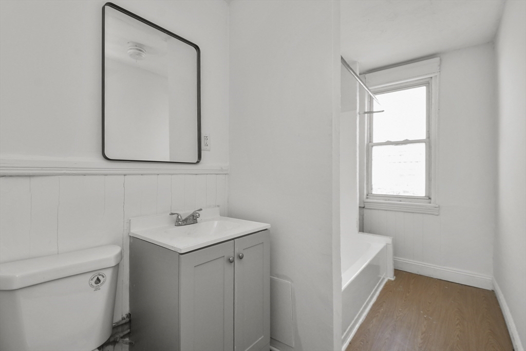 23 Ashton Street Worcester, MA 01605 - Photo 26 of 41 a bathroom with a sink and a mirror