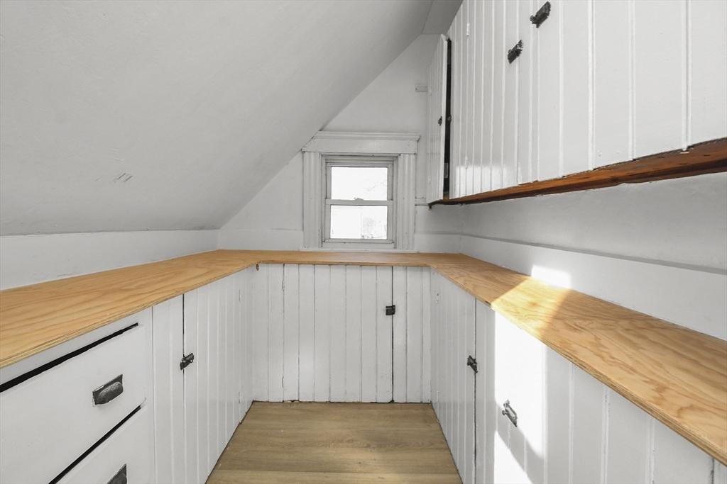 23 Ashton Street Worcester, MA 01605 - Photo 31 of 41 a view of a hallway with wooden floor and staircase