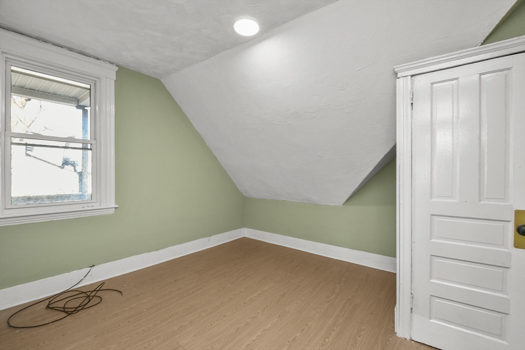 23 Ashton Street Worcester, MA 01605 - Photo 32 of 41 an empty room with a window
