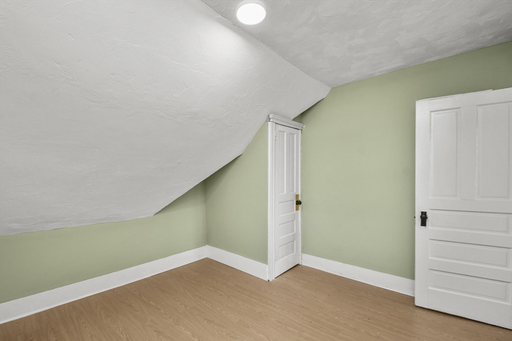 23 Ashton Street Worcester, MA 01605 - Photo 33 of 41 a view of empty room with wooden floor