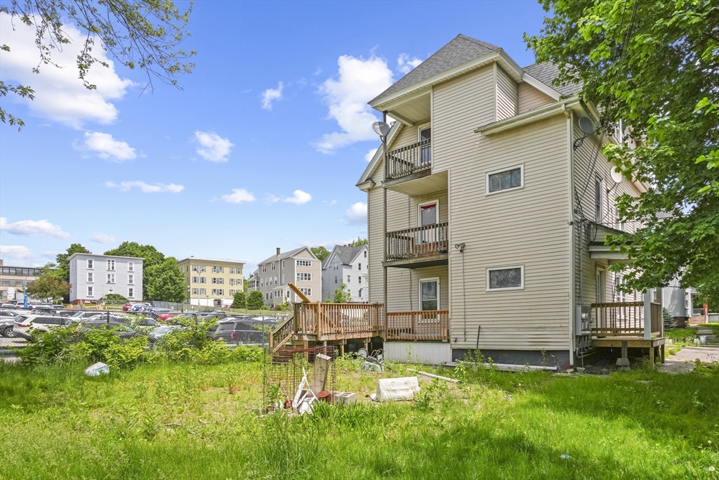 23 Ashton Street Worcester, MA 01605 - Photo 38 of 41 a view of a house with a backyard