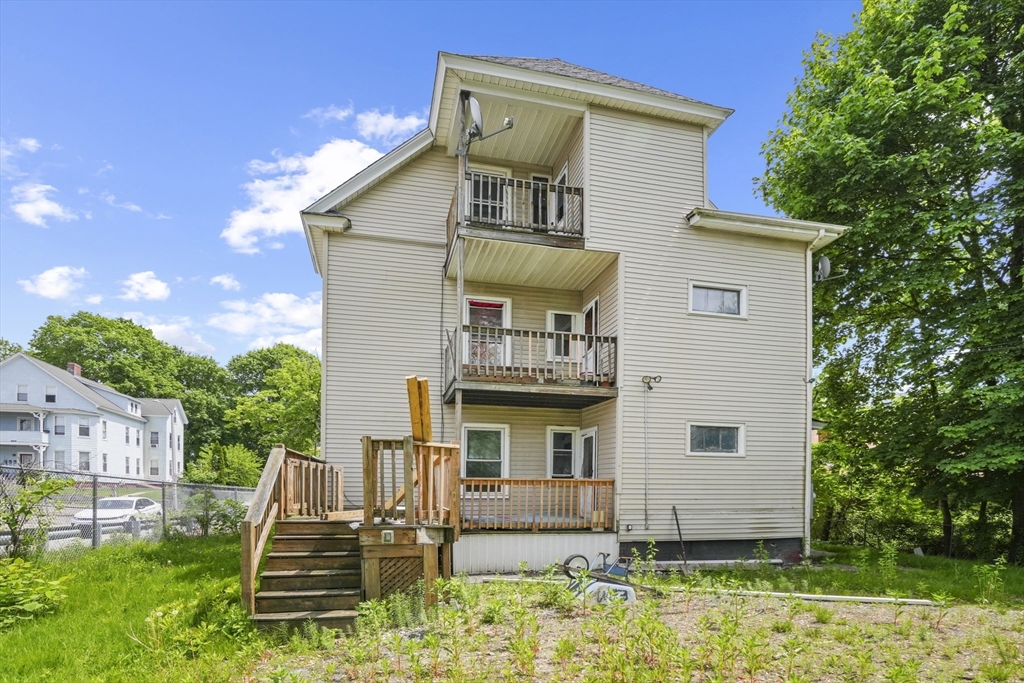 23 Ashton Street Worcester, MA 01605 - Photo 40 of 41 a front view of a house with a yard