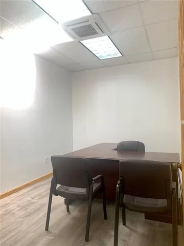 a view of a workspace with furniture