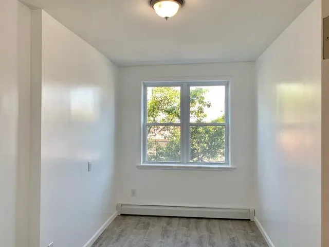 an empty room that has a window