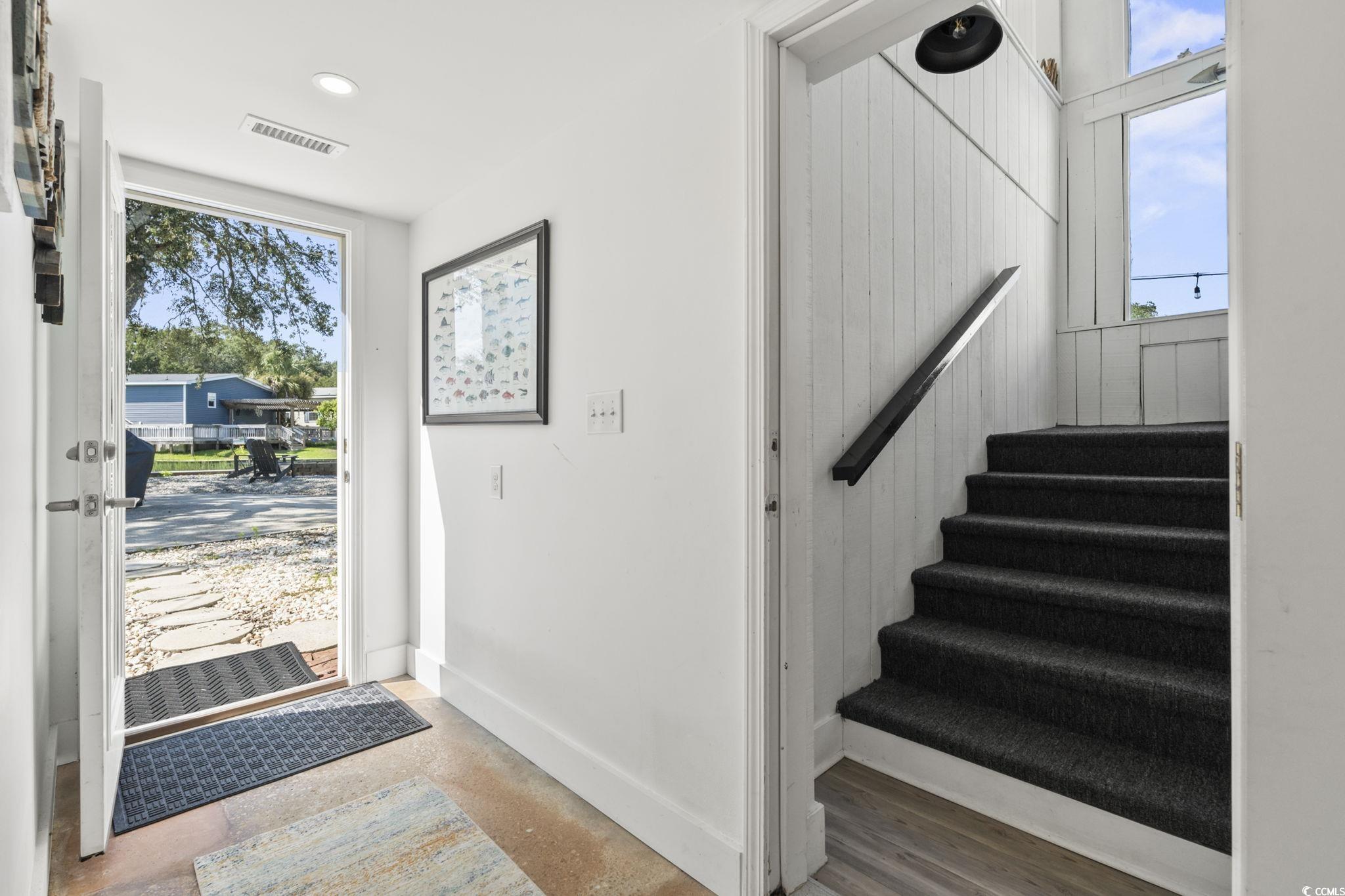 3182 State Rd S-26-816 Murrells Inlet, SC 29576 - Photo 19 of 40 Foyer with baseboards and stairway