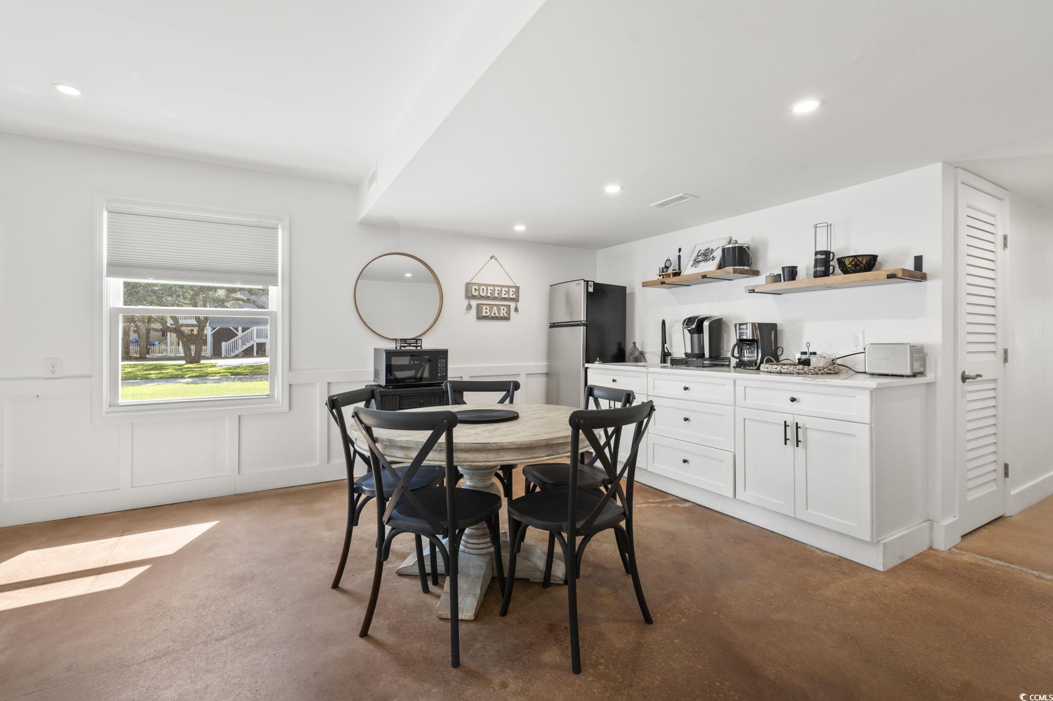 3182 State Rd S-26-816 Murrells Inlet, SC 29576 - Photo 23 of 40 Dining room featuring a decorative wall, recessed lighting, and wainscoting
