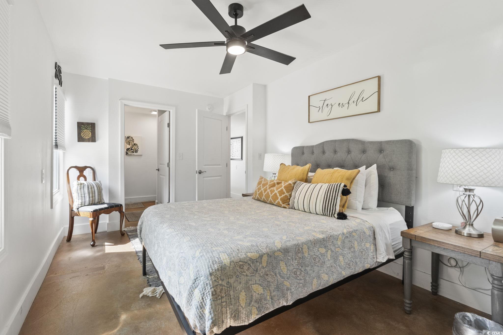 3182 State Rd S-26-816 Murrells Inlet, SC 29576 - Photo 25 of 40 Bedroom featuring finished concrete floors and a ceiling fan