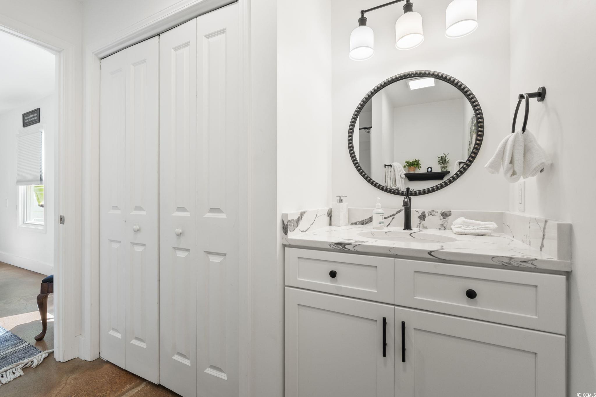 3182 State Rd S-26-816 Murrells Inlet, SC 29576 - Photo 29 of 40 Bathroom with a closet and vanity