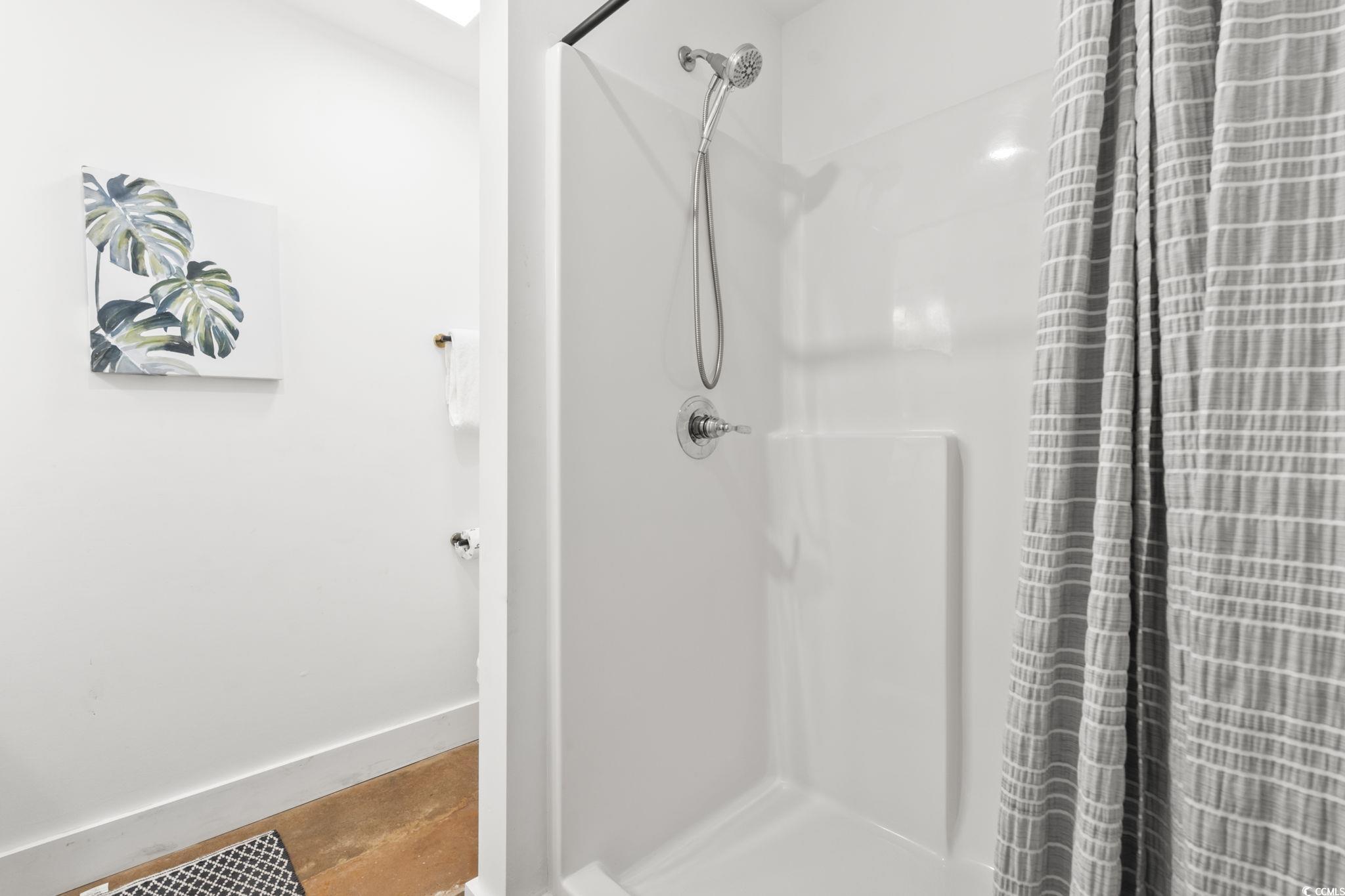 3182 State Rd S-26-816 Murrells Inlet, SC 29576 - Photo 30 of 40 Full bathroom featuring a shower stall and baseboards