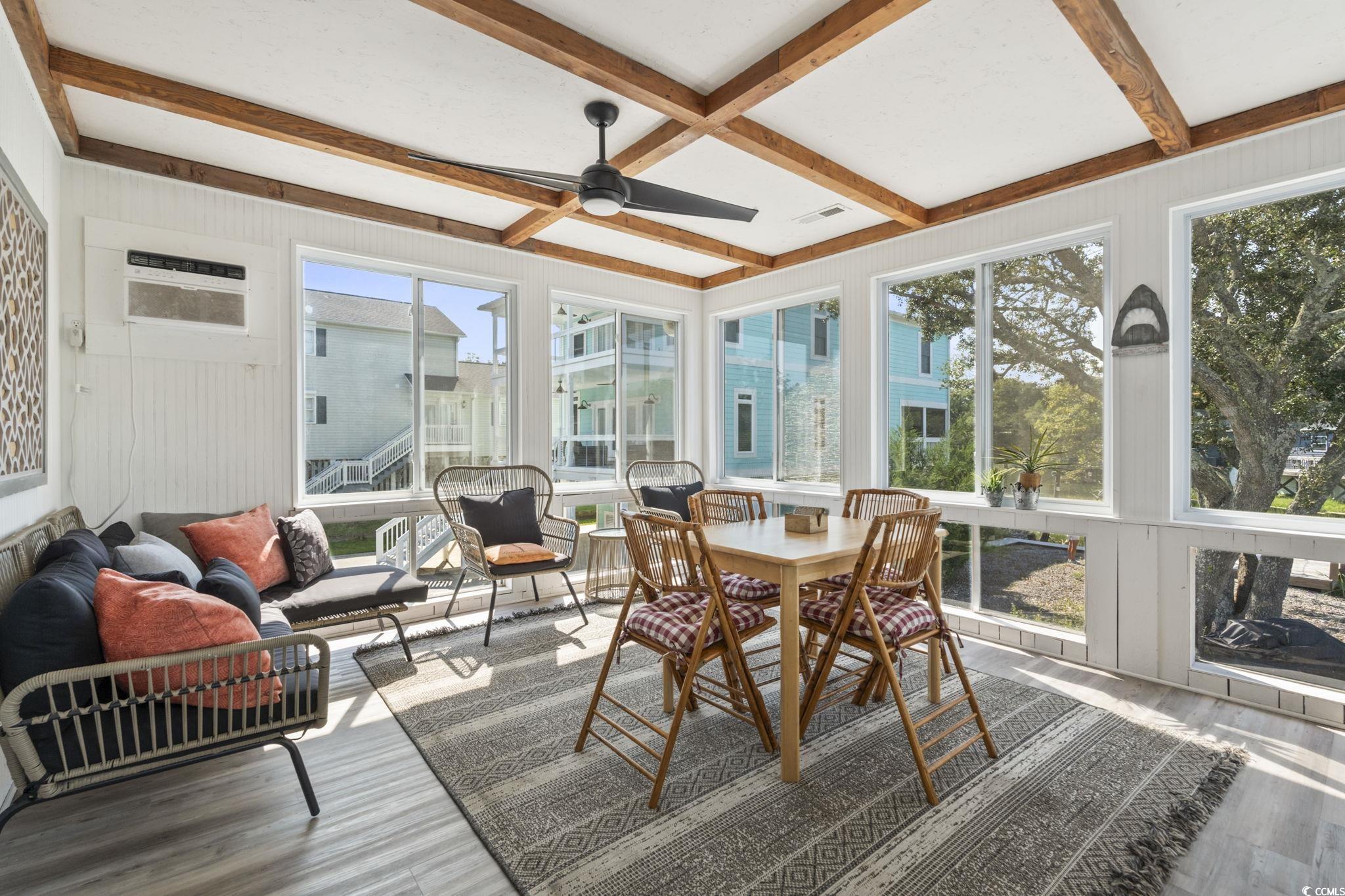 3182 State Rd S-26-816 Murrells Inlet, SC 29576 - Photo 31 of 40 Sunroom with beam ceiling, wood finished floors, and coffered ceiling