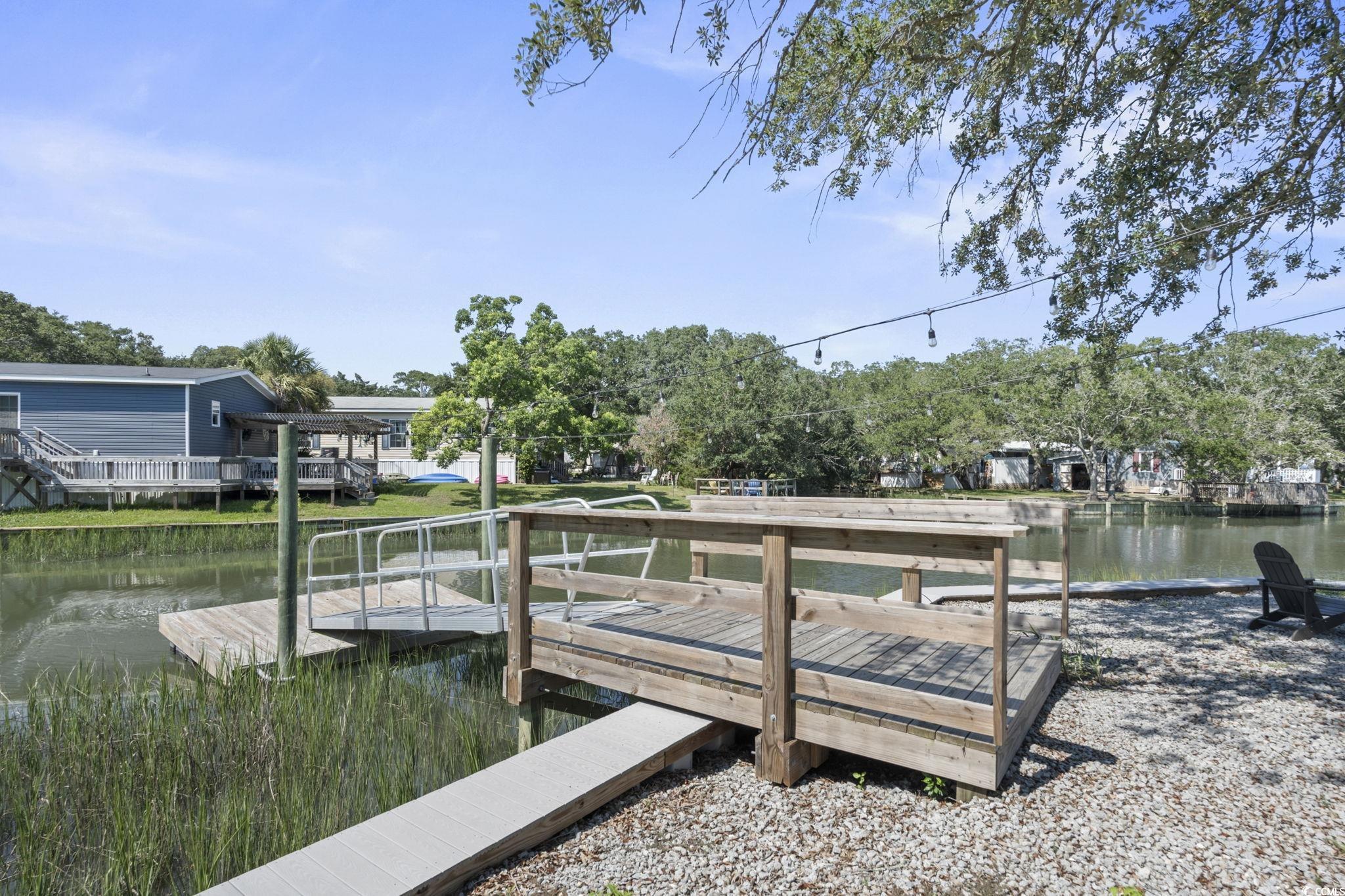 3182 State Rd S-26-816 Murrells Inlet, SC 29576 - Photo 37 of 40 Dock area featuring a water view