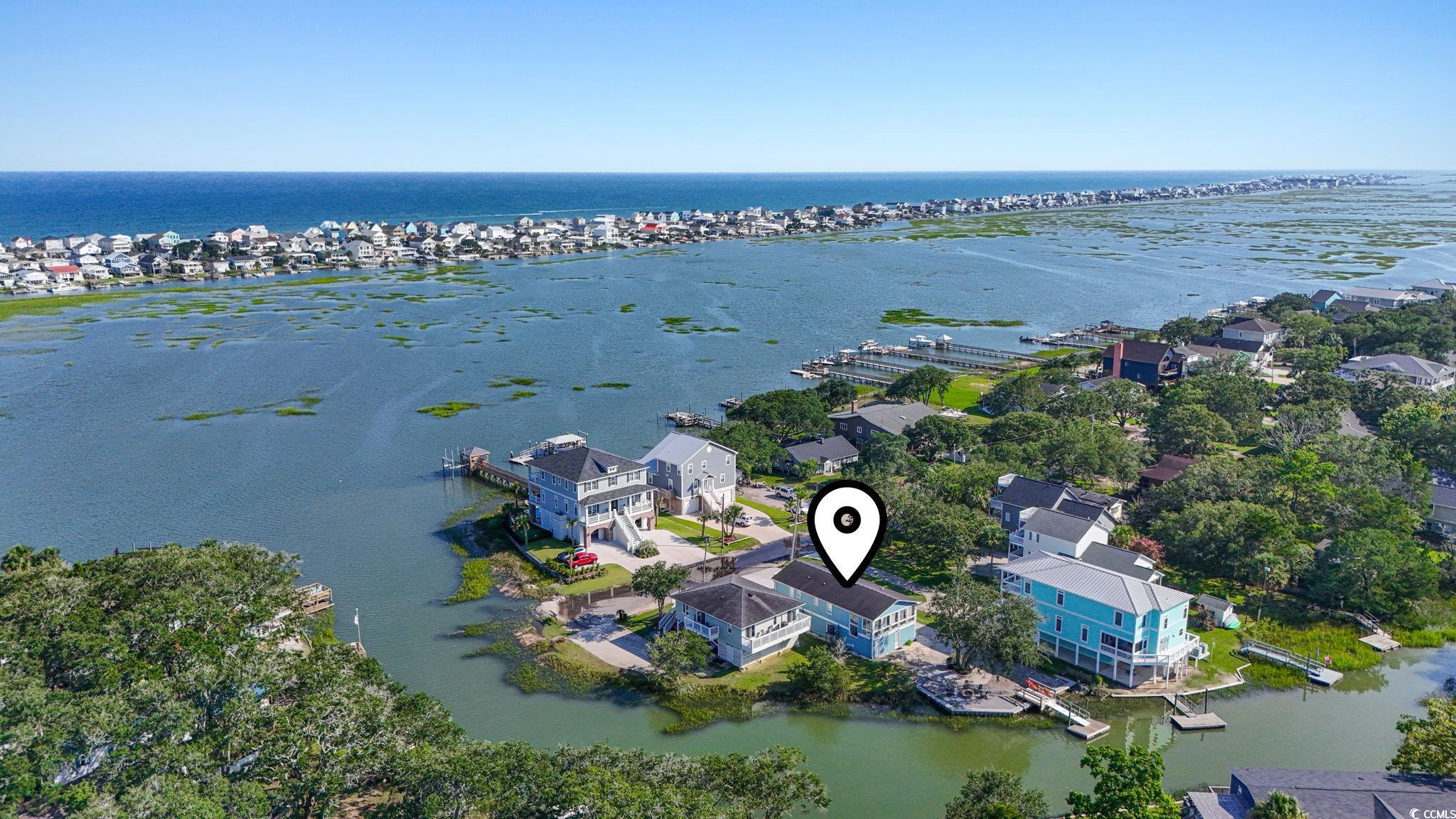 3182 State Rd S-26-816 Murrells Inlet, SC 29576 - Photo 39 of 40 Aerial view of residential area featuring a large body of water