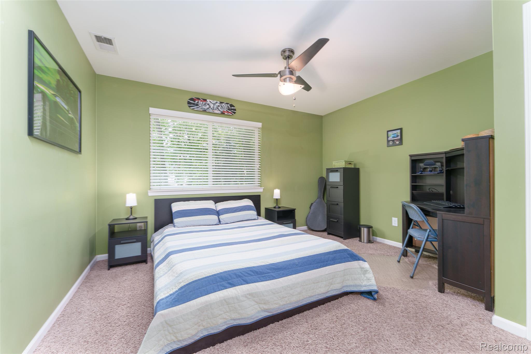 2172 Devonshire Road Bloomfield Hills, MI 48302 - Photo 33 of 45 Carpeted bedroom featuring a large window with blinds, ceiling fan with integrated lighting, and painted walls