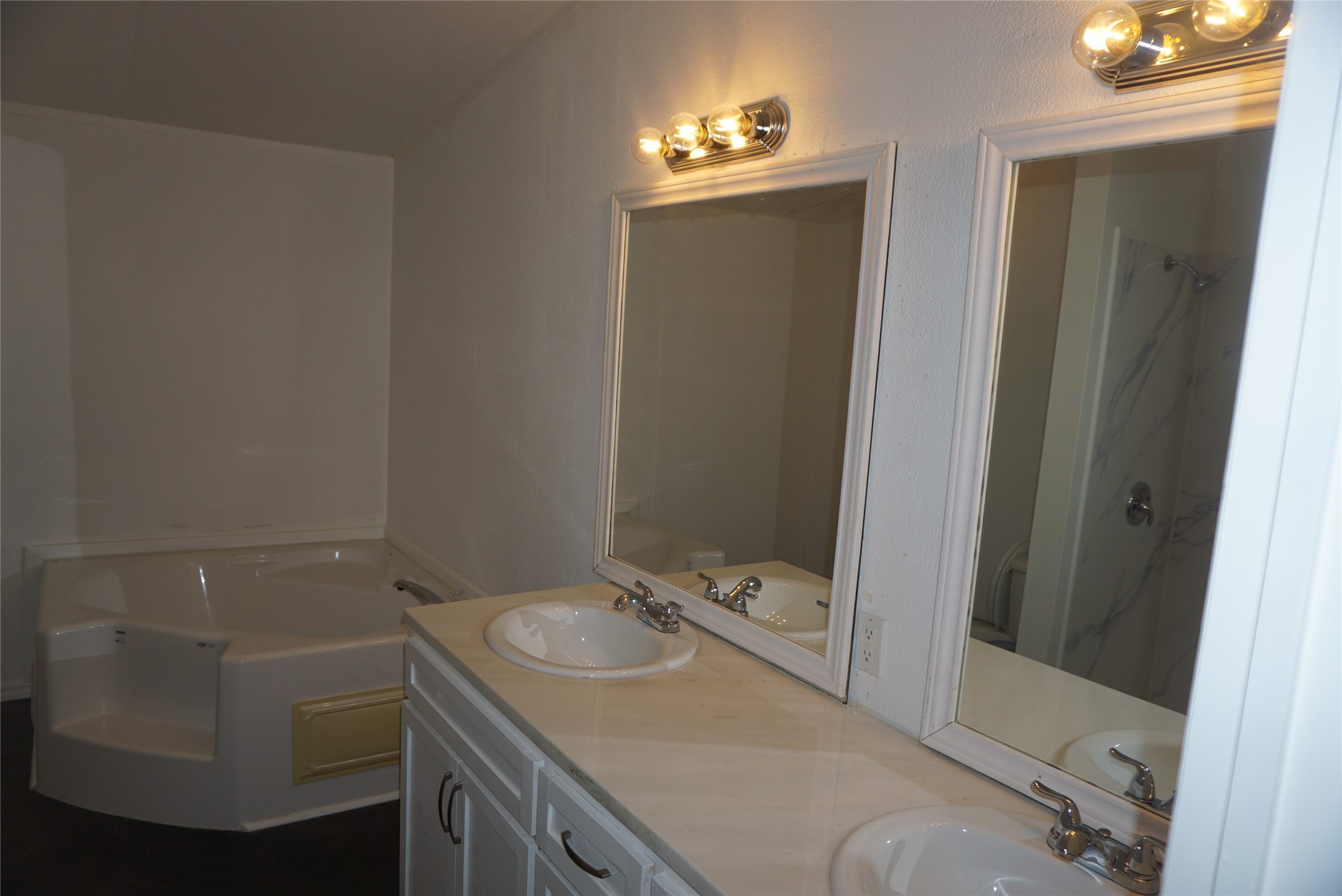 9603 Cedar Ridge Court Willis, TX 77318 - Photo 11 of 25 a bathroom with a sink and mirror