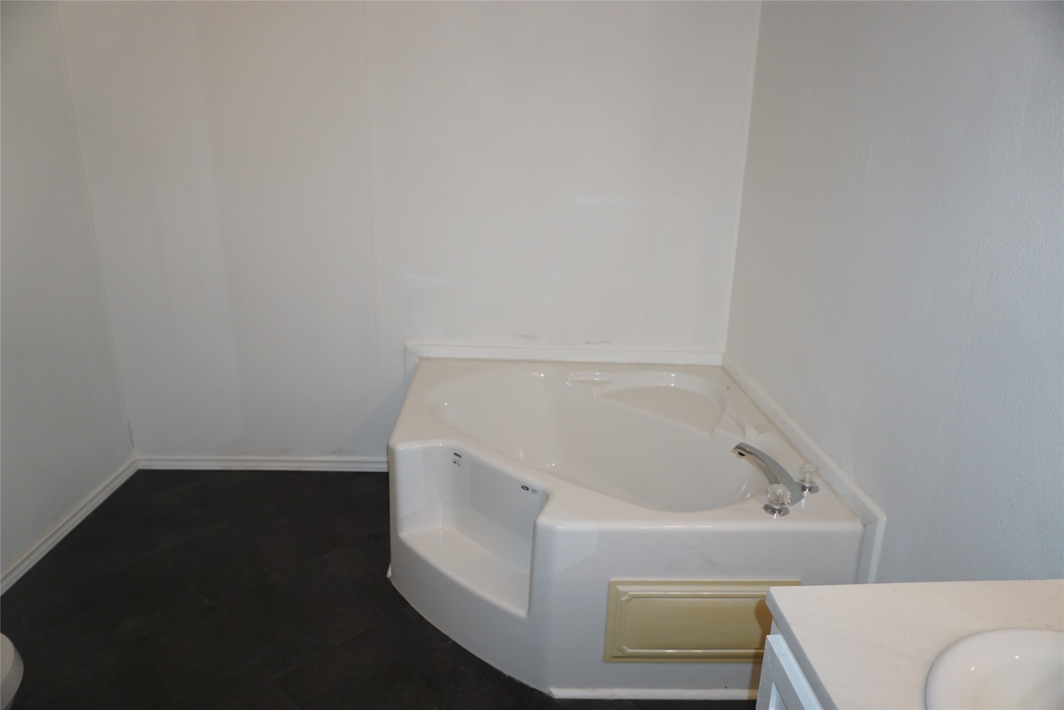 9603 Cedar Ridge Court Willis, TX 77318 - Photo 12 of 25 a bathroom with a bathtub
