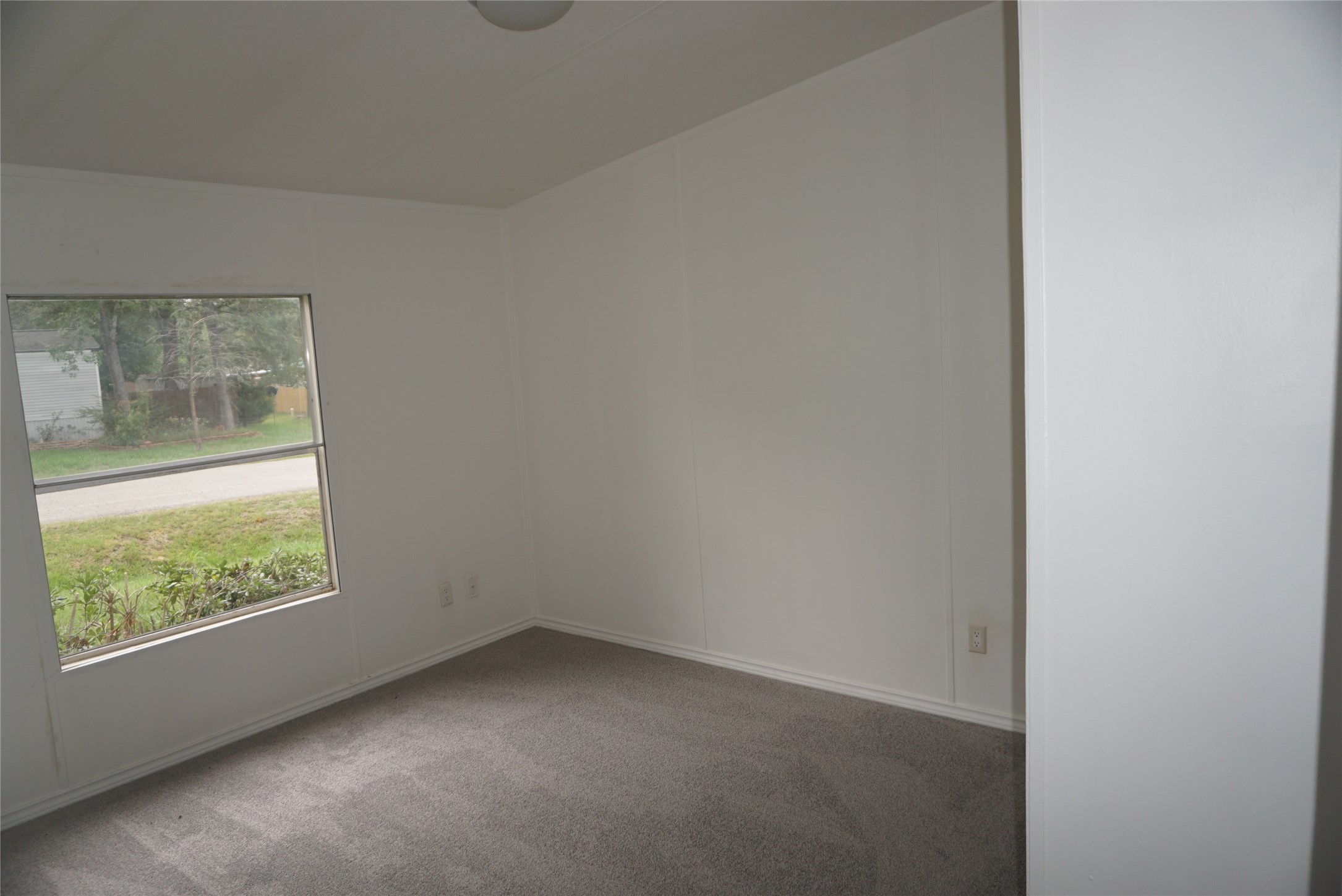 9603 Cedar Ridge Court Willis, TX 77318 - Photo 20 of 25 a view of an empty room with a window