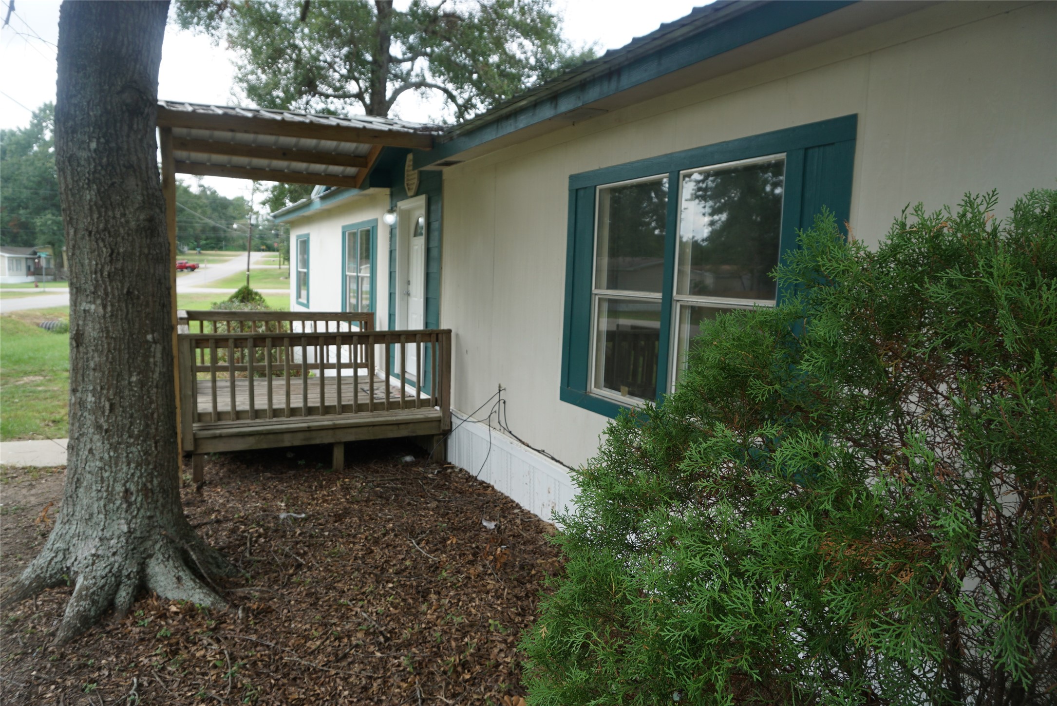 9603 Cedar Ridge Court Willis, TX 77318 - Photo 2 of 25 a view of a porch with a small yard
