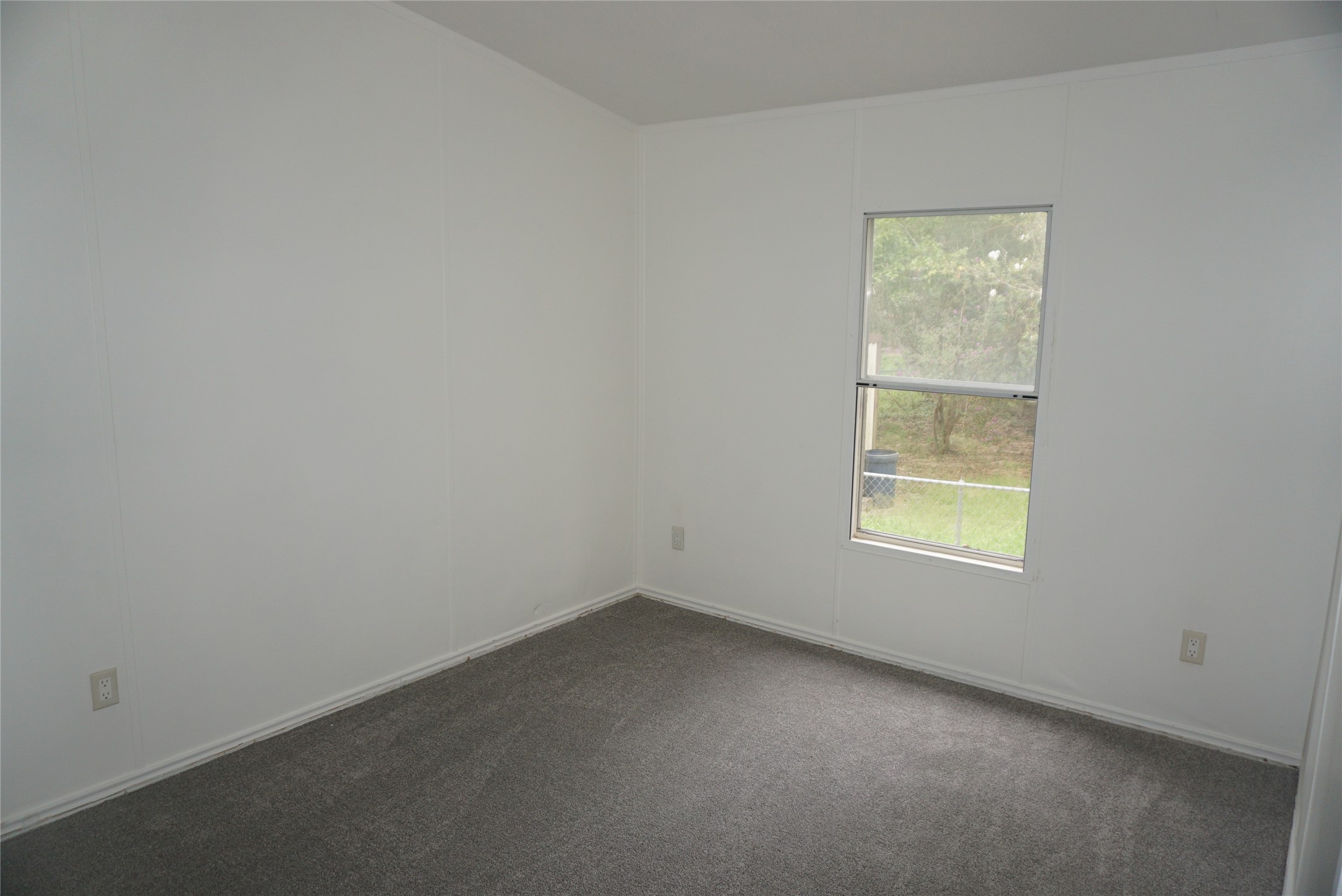 9603 Cedar Ridge Court Willis, TX 77318 - Photo 21 of 25 an empty room with a window