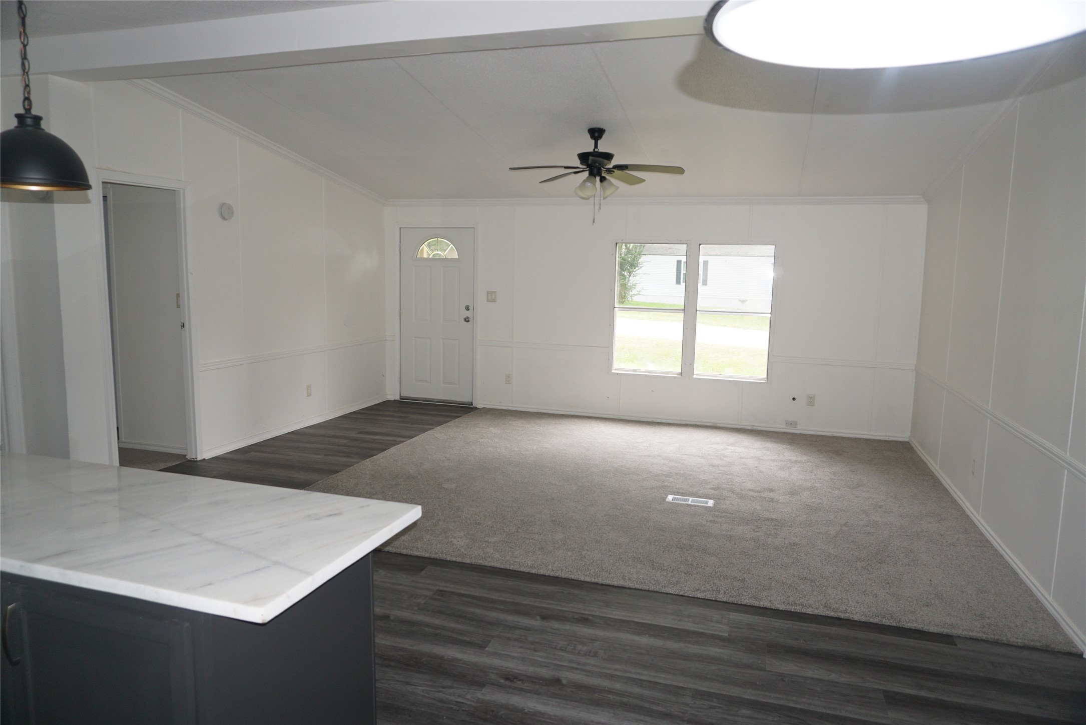 9603 Cedar Ridge Court Willis, TX 77318 - Photo 23 of 25 an empty room with windows and cabinet