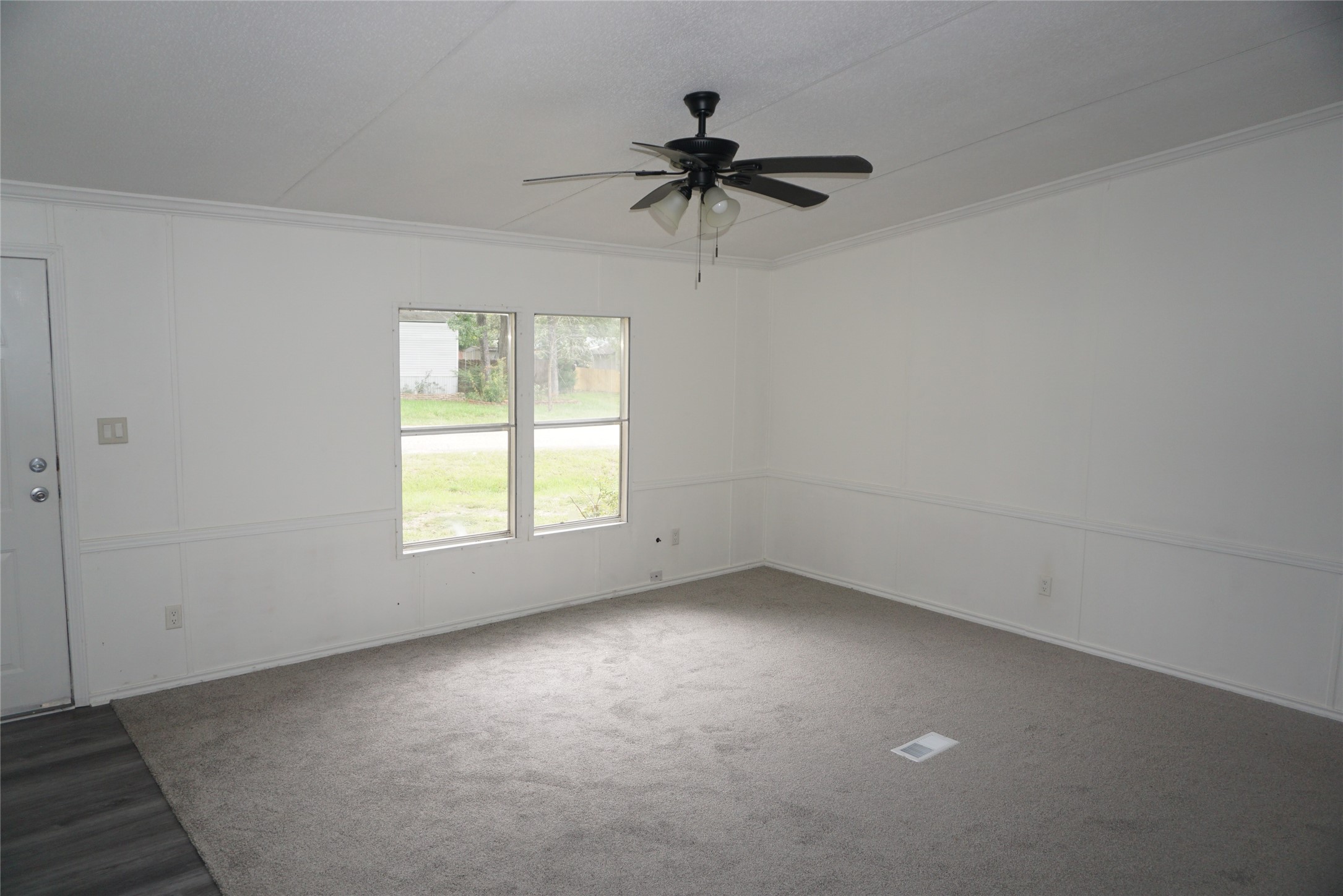 9603 Cedar Ridge Court Willis, TX 77318 - Photo 4 of 25 an empty room with a window