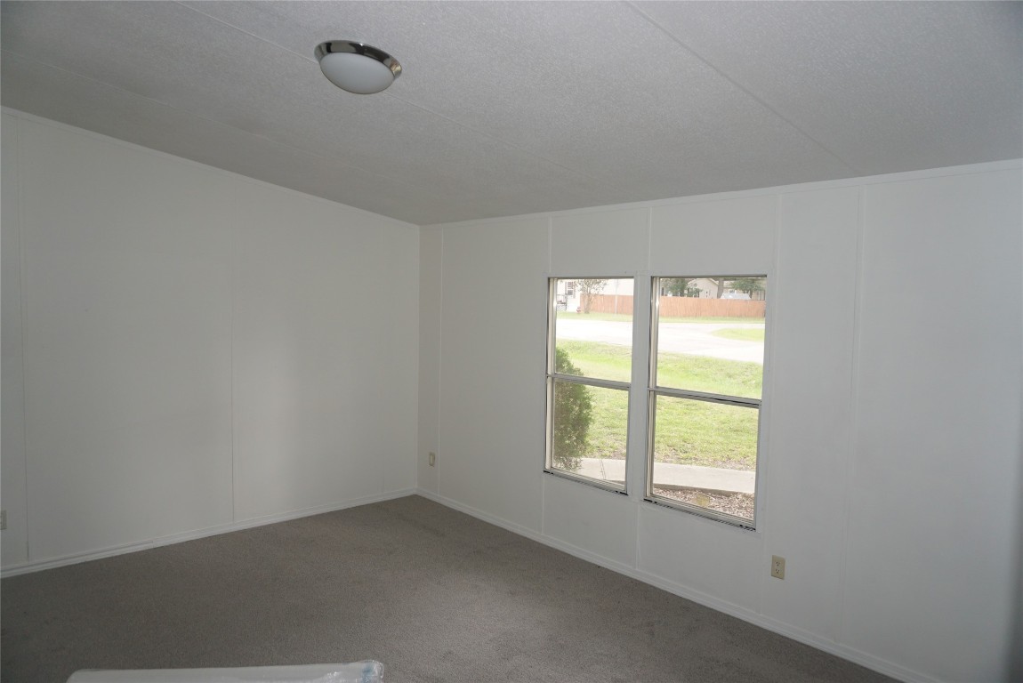 9603 Cedar Ridge Court Willis, TX 77318 - Photo 10 of 25 an empty room with a window
