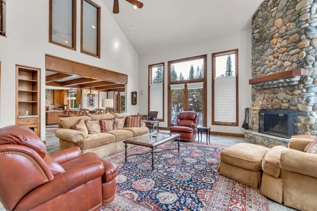 a kitchen with stainless steel appliances granite countertop a sink and a wooden floors