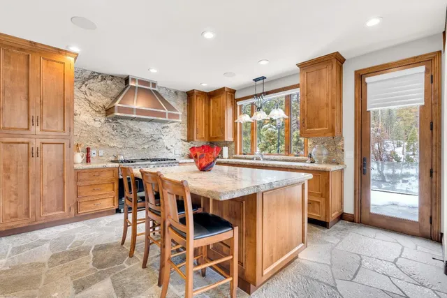 a bedroom with a bed couch and window