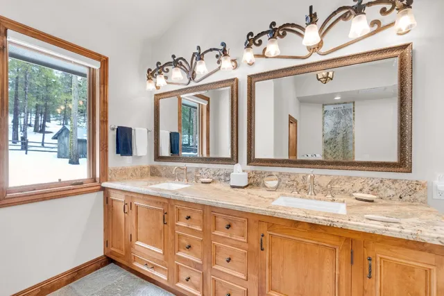 a view of a bathroom with a shower and a sink