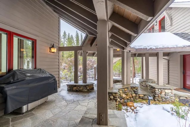 a bathroom with a granite countertop sink toilet and mirror