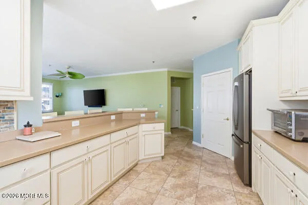 a front view of a multi story residential apartment building with yard and parking space