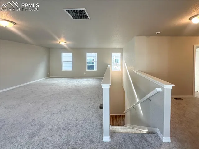 a view of an empty room and closet