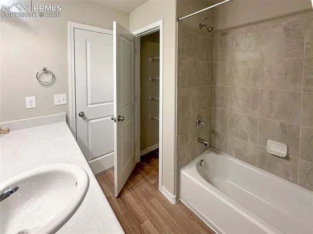 a view of an empty room and a window