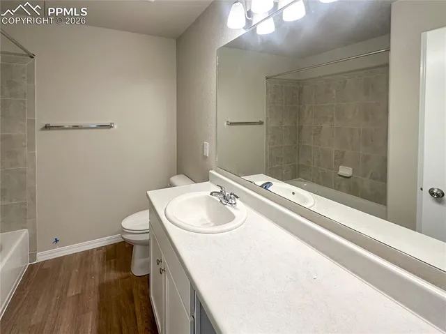 an empty room with a empty space and windows