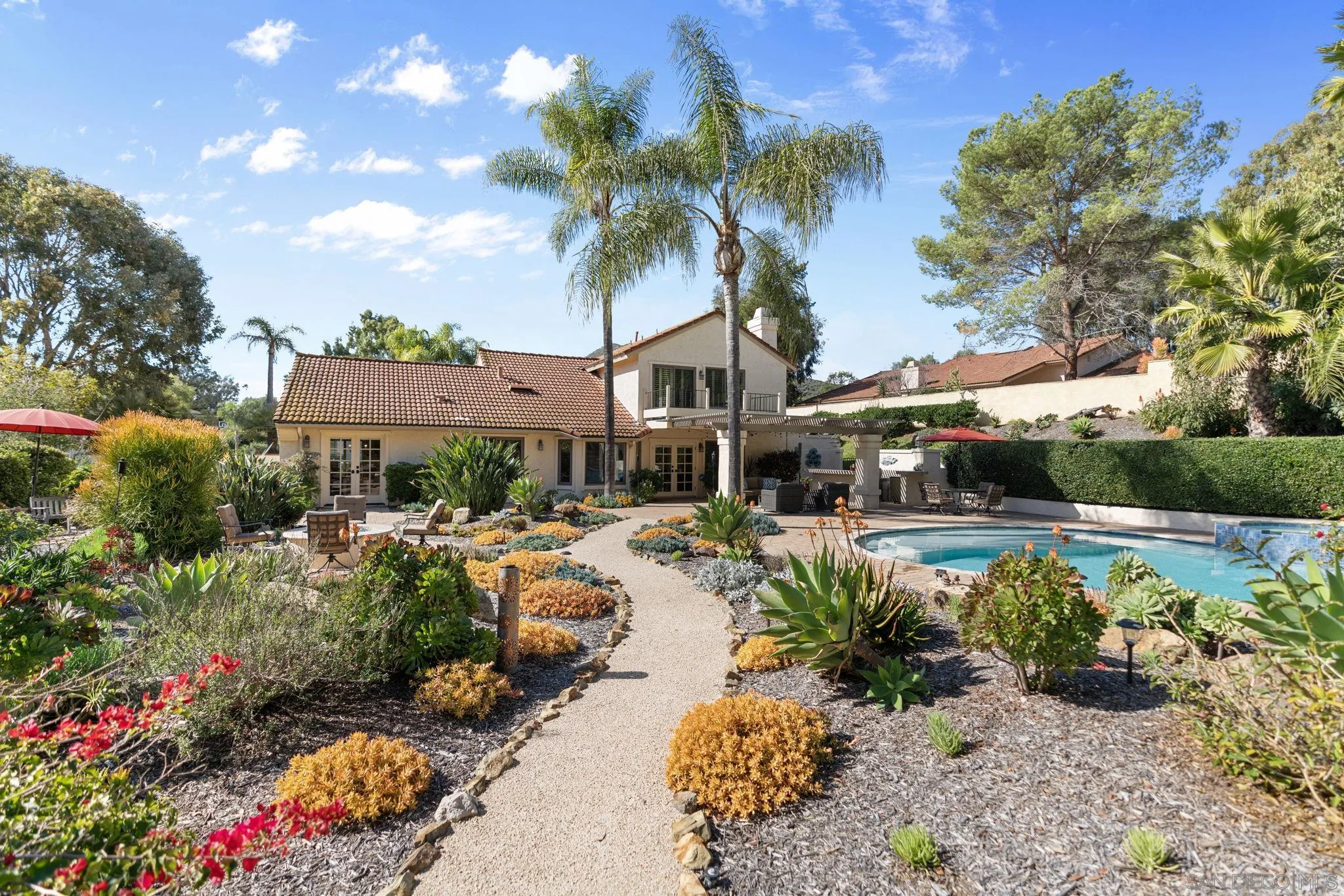 452 Avenida Adobe Escondido, CA 92029 - Photo 7 of 11 a front view of multiple houses with yard