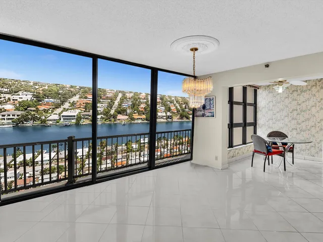 a view of a kitchen with a sink and cabinets
