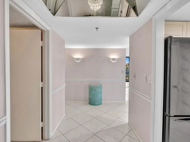 a bedroom with a balcony a bed and a large window