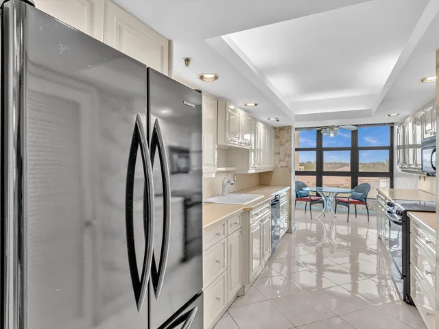a view of a porch with a floor to ceiling window and wooden floor